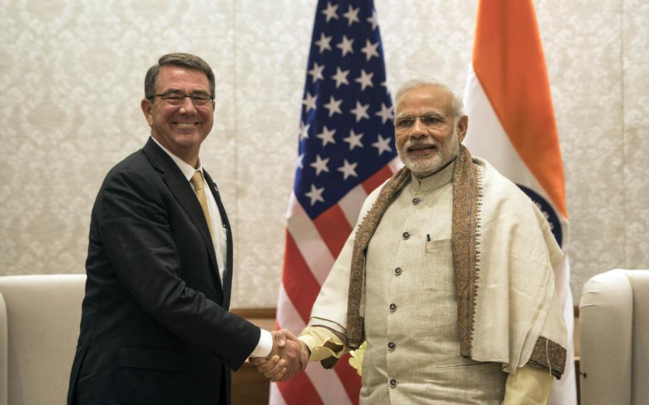 Secretary of Defense Ash Carter poses with India's Prime Minister Narendra Modi last month in New Delhi, India. Carter called India a "major defense partner" during the meeting.