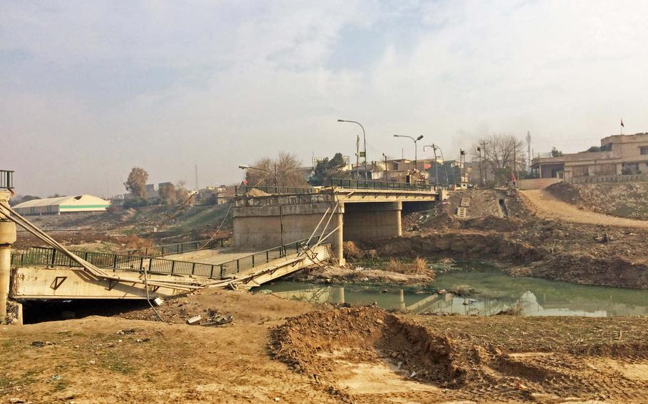 A damaged bridge over the Khoser River in Mosul, Iraq,  Saturday, Jan. 21, 2017. The area was liberated in a surprise night operation by Iraqi Special Forces last week. 