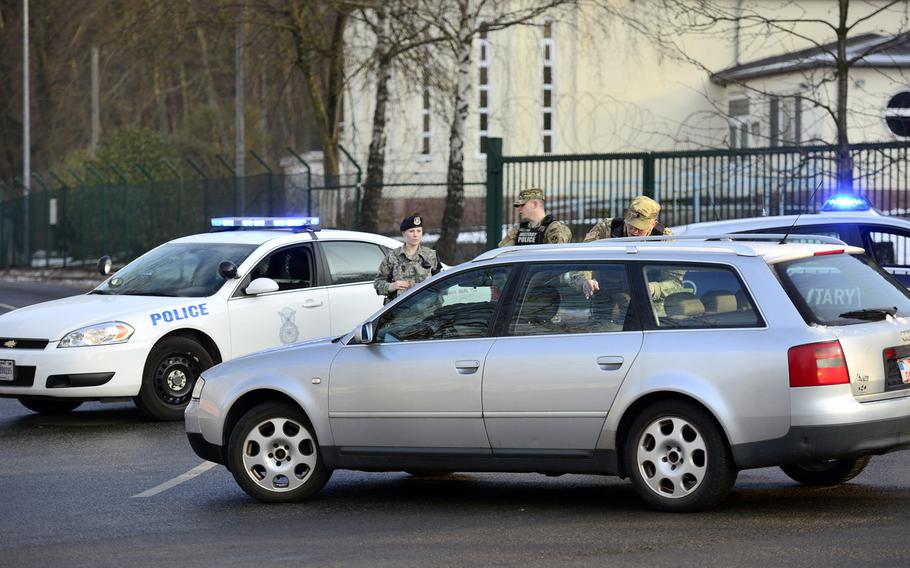 U.S. Army Military Police and Air Force Security Forces direct traffic away from the gate at Pulaski Barracks in Kaiserslautern, Germany, on Monday, Jan. 23, 2017. The gate was closed for several hours due to a unspecified security incident.
