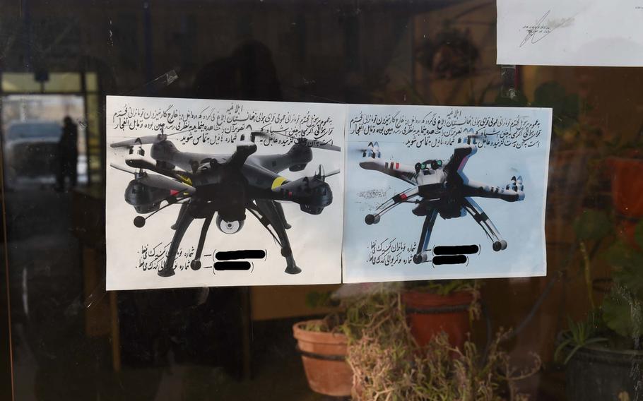 Two flyers at an Afghan Air Force base in Kabul warn troops that hobby-style quadcopters could be armed and tells them to notify base security immediately if they ever see one in the air, Jan. 16, 2017. The phone numbers have been blacked out.