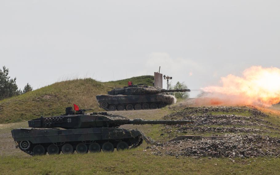 German Leopard 2A6 battle tanks fire downrange in May 2016 during maneuvers at the 2016 Strong Europe Tank Challenge held at the Grafenwoehr training area. Germany faces problems in upgrading its military after criticism by President Donald Trump.