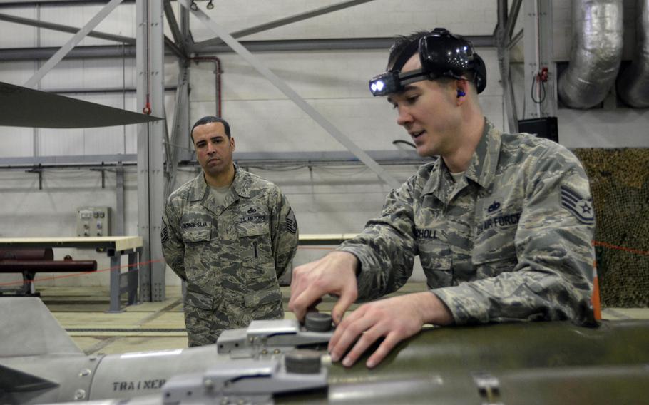 A weapons load crew team member from the 48th Maintenance Group prepares ammunition for an F-15C Eagle during the annual weapons load crew competition at RAF Lakenheath, England, Wednesday, Jan. 25, 2017.