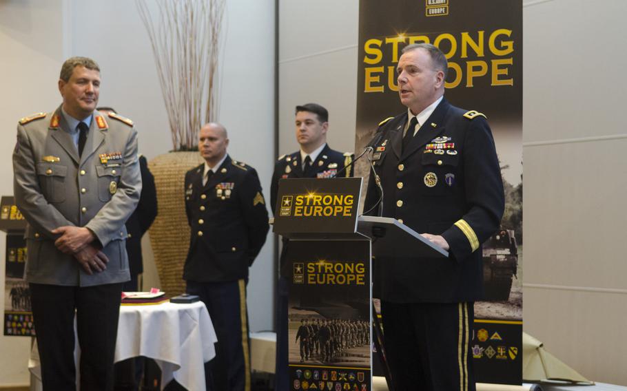 Lt. Gen. Ben Hodges, commanding general of U.S. Army Europe, speaks at a ceremony bidding farewell to the command's first German chief of staff, German Army Brig. Gen. Markus Laubenthal, left, Thursday, Jan. 26, 2017, at Clay Kaserne in Wiesbaden, Germany.