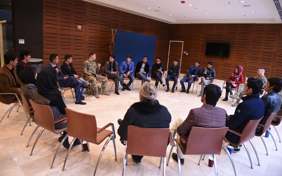 U.S. Army Lt. Philip Tappan of the U.S. Forces Afghanistan Band leads a talk on how to make a living as a musician. The lecture was part of a three-day conference with music students and instructors from Kabul University at the U.S. Embassy, Wednesday, Jan. 25, 2017.