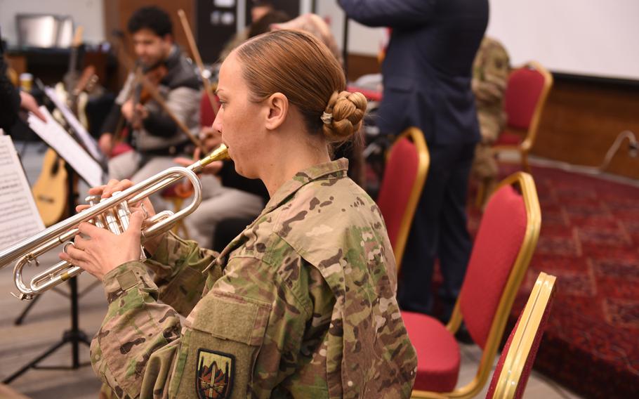 Sgt. Kendell Rivera of the U.S. Forces Afghanistan Band rehearses for a joint concert with students and instructors from Kabul University's music program at the U.S. Embassy in Kabul, Wednesday, Jan. 25, 2017.