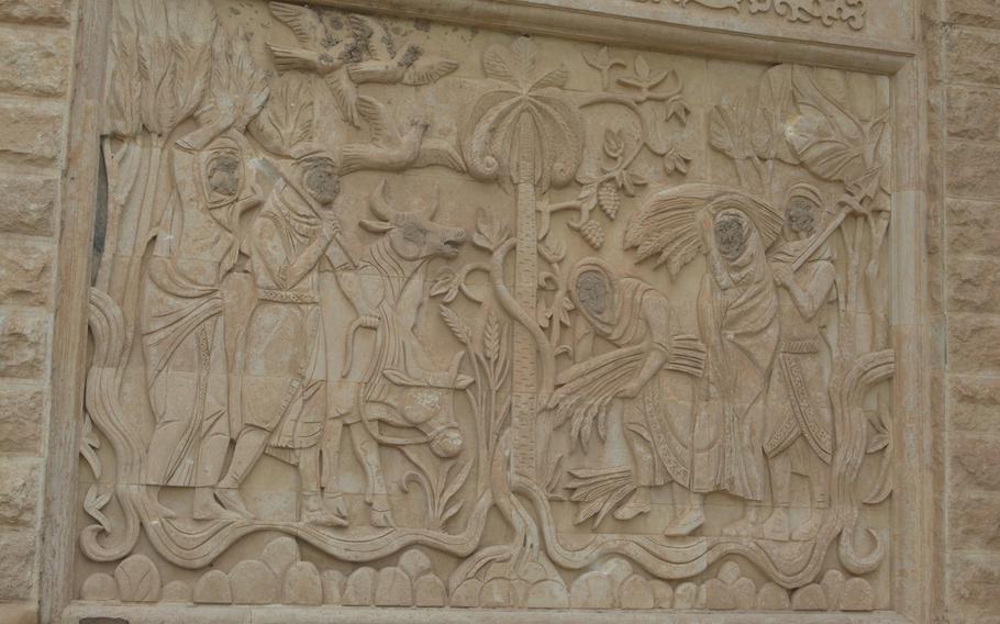 The Islamic State group eradicated the faces from this frieze on a palace in Mosul, Iraq, that once served as the headquarters for Gen. David Petraeus.