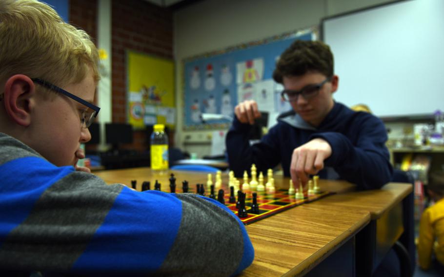 Caleb Thomas, left, and John Newby exercise their mental agility while playing a game of chess on Thursday, Jan. 26, 2017, during a family wellness night at Landstuhl Elementary/Middle School in Landstuhl, Germany.