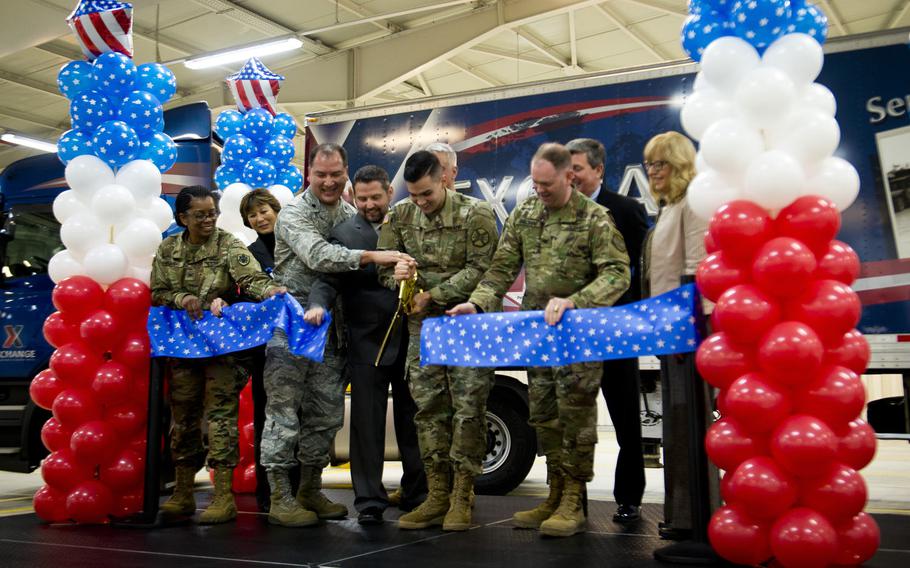 Army and Air Force Exchange Service personnel cut the ribbon for the distribution center at Germersheim Army Depot, Germany, on Wednesday, Feb. 1, 2017. The renovated warehouses in Germersheim are closer to AAFES customers in Europe and downrange than the center's previous location.