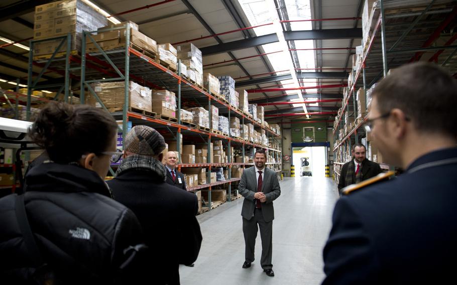 Jason Rakestraw, Europe Regional Distribution Center manager, gives a tour of the Army and Air Force Exchange Service facility during the grand opening at Germersheim Army Depot, Germany, on Wednesday, Feb. 1, 2017. The distribution center in Germersheim has 420,000 square feet of warehouse space.