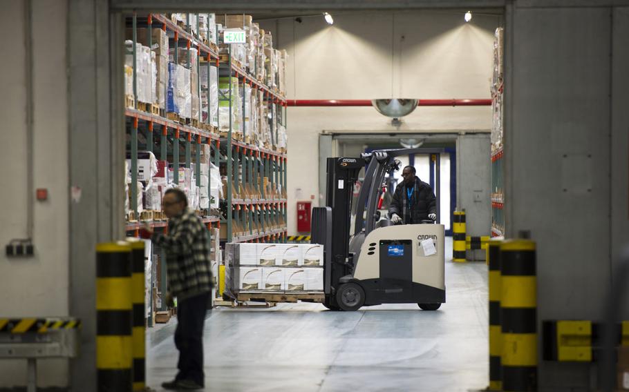A forklift operator moves a pallet at the Army and Air Force Exchange Service distribution center at Germersheim Army Depot, Germany, on Wednesday, Feb. 1, 2017.