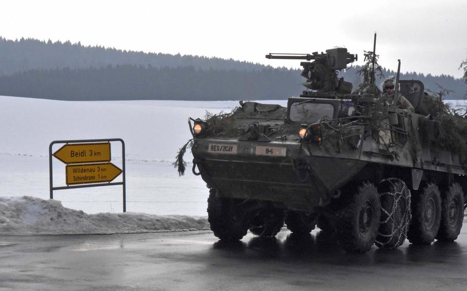An Army Stryker passes a road sign during training that brought solders off base and into the German countryside, Thursday, Feb. 2, 2017.