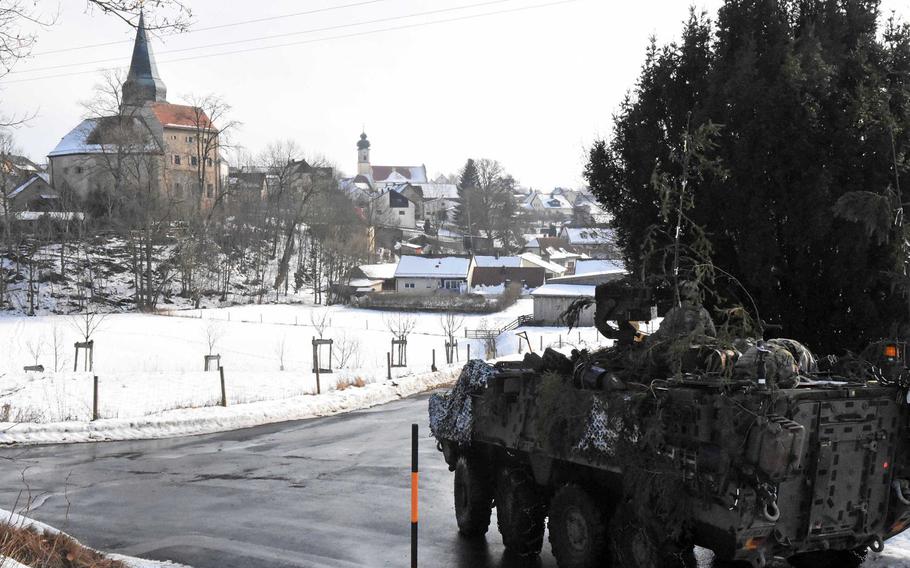 Army scouts pull up to a small German village in their Stryker during maneuver training that brought them through several towns and hamlets, Thursday, Feb. 2, 2017.