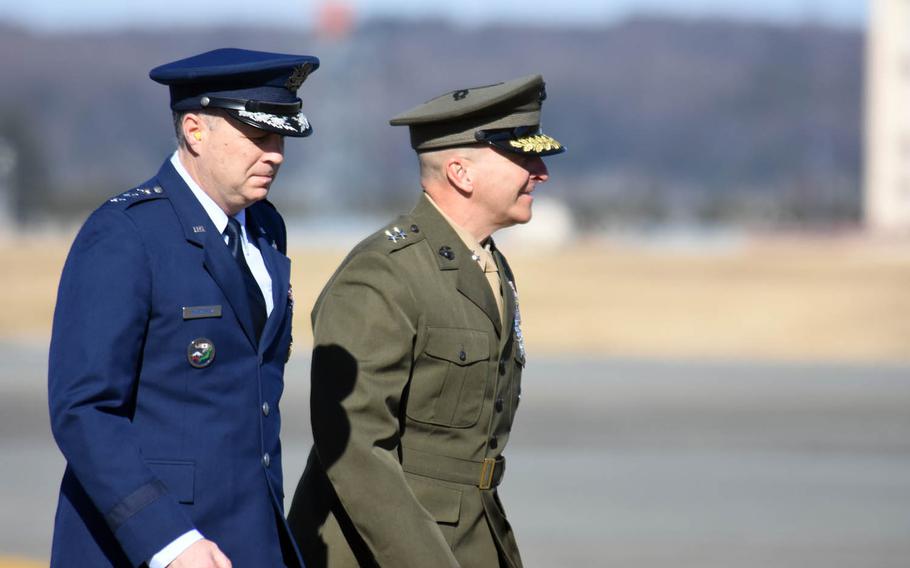 Lt. Gen. Jerry Martinez, left, U.S. Forces Japan commander, and Maj. Gen. Charles Chiarotti, USFJ's deputy commander, walk out to greet Secretary of Defense Jim Mattis at Yokota Air Base, Japan, Friday, Feb. 3, 2017. The trip is Mattis' first to Japan as Pentagon chief.