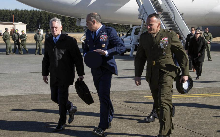 Secretary of Defense Jim Mattis, left, arrives at Yokota Air Base, Japan, Friday, Feb. 3, 2017. The Pentagon chief was greeted by Lt. Gen. Jerry Martinez, center, U.S. Forces Japan commander, and Maj. Gen. Charles Chiarotti, USFJ's deputy commander.