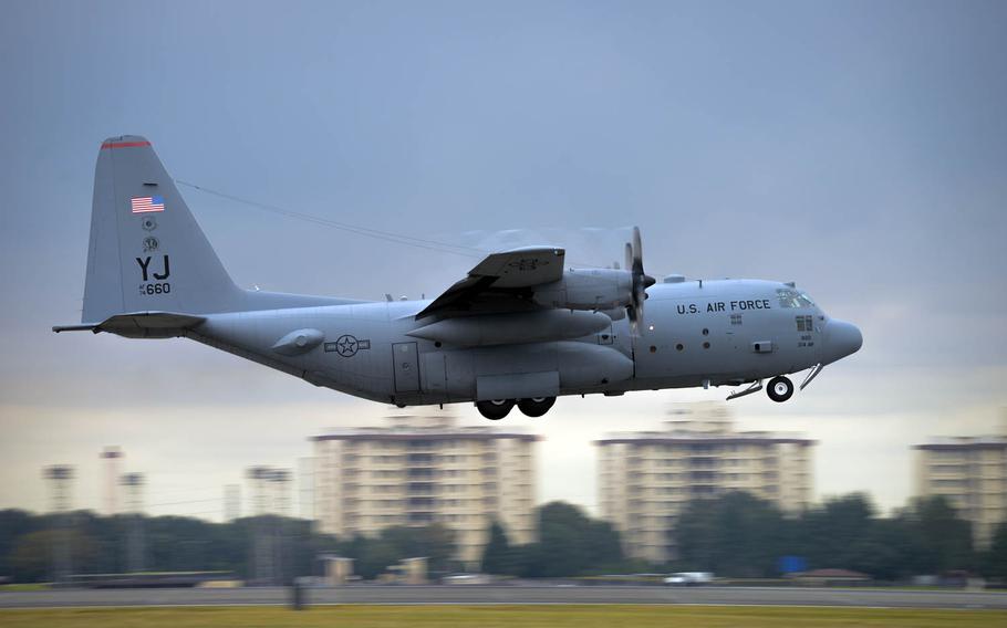 A C-130 Hercules takes off from Yokota Air Base, Japan.