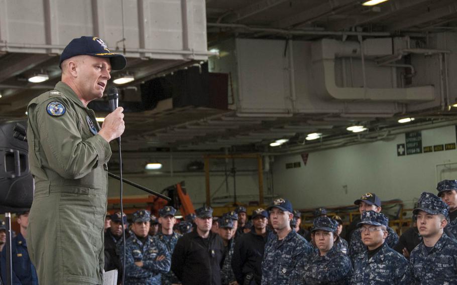 Rear Adm. Greg Fenton, shown here as commanding officer speaking aboard the aircraft carrier USS George Washington in 2014, has been selected as the next commander of Naval Forces Japan and Navy Region Japan.