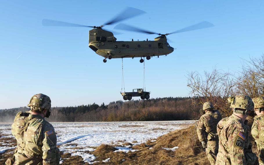 U.S. Army soldiers attending the Pathfinder course at Grafenwoehr, Germany, observe the sling loading of a Humvee to a CH-47 Chinook, Tuesday, Feb. 14, 2017.