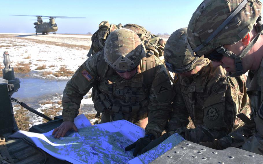 U.S. soldiers map out a drop zone at the Pathfinder course at Grafenwoehr, Germany, Tuesday, Feb. 14, 2017.