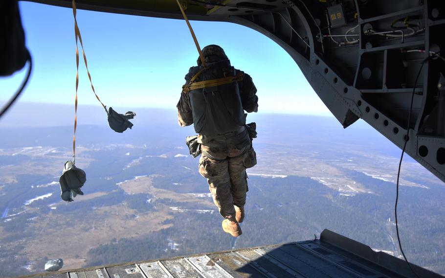 A U.S. soldier jumps from a CH-47 Chinook during the Pathfinder course at Grafenwoehr, Germany, Wednesday, Feb. 15, 2017.