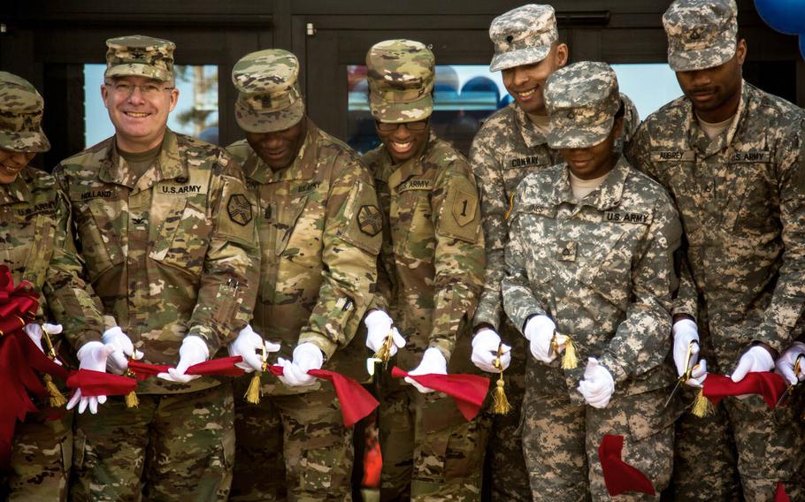Col. Joseph Holland, second from left, Camp Humphreys' commander, helps soldiers open the garrison's Warrior Zone entertainment complex, Thursday, Feb. 16, 2017, in South Korea.