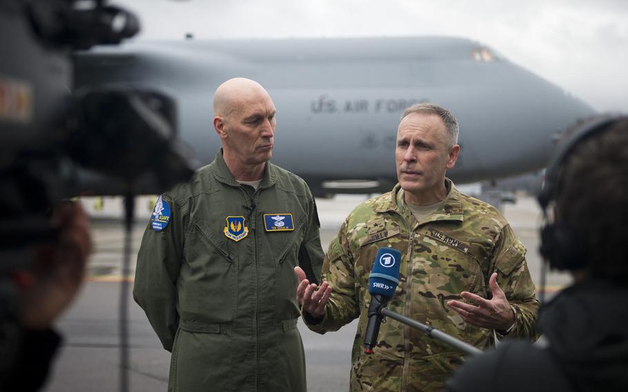 Brig. Gen. Phillip Jolly, U.S. Army Europe Army Reserve Engagement Cell director, right, and Maj. Gen. Timothy Zadalis, U.S. Air Forces in Europe and Africa vice commander, speak to the media about the arrival of four AH-64 attack helicopters at Ramstein Air Base, Germany, on Wednesday, Feb. 22, 2017.