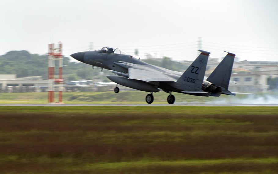 An Air Force F-15 Eagle from the 67th Fighter Squadron lands at Kadena Air Base, Japan, in November.