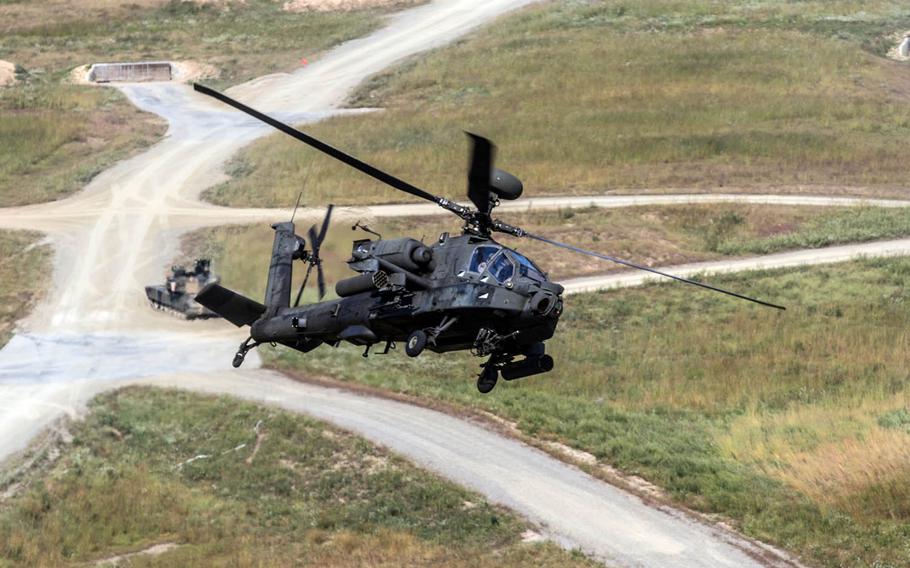 An AH-64 Apache provides attack support to ground forces at South Korea's Rodriguez live-fire training complex in 2015.