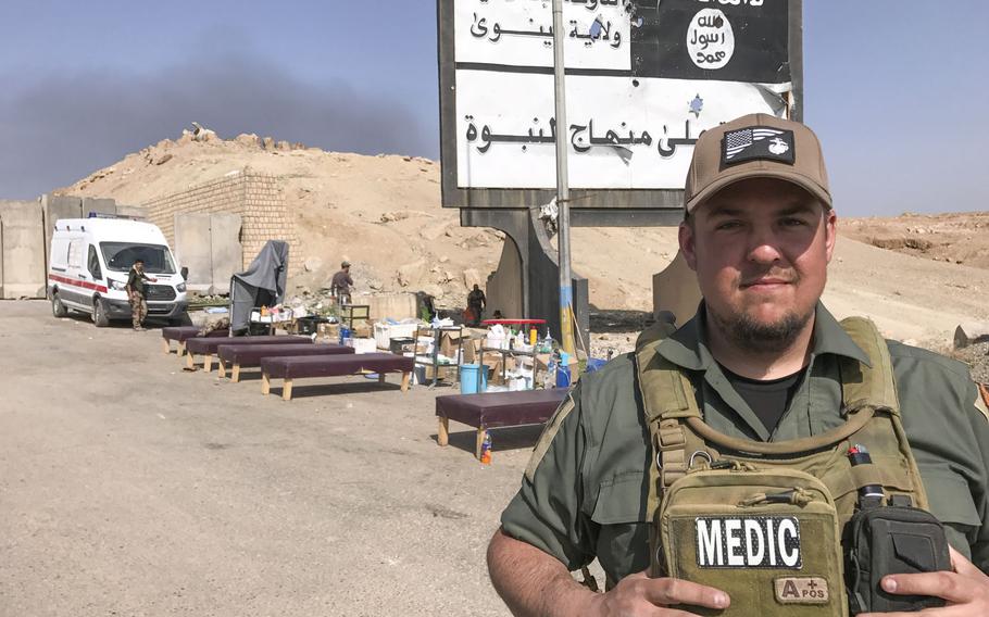 U.S. Marine Corps veteran Chris Lint, of Santa Cruz, Calif., is pictured here on Tuesday, Feb. 28, 2016, at a roadside medic station near the Wadi Hajar neighborhood of Mosul. Lint is one of more than a dozen medics working with a Slovak nonprofit to treat wounded Iraqis on the front line of the Mosul battle.