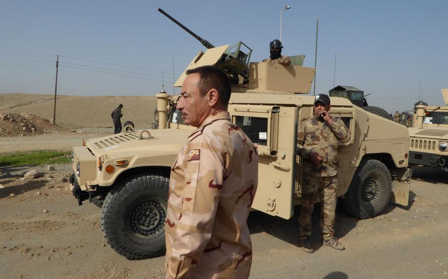 Commander of Nineveh Operations, Maj. Gen. Najim al Jabouri, visits an area where the Iraqi army's Counter Terrorism Service was preparing to advance on Mosul's Wadi Hajar neighborhood, Tuesday, Feb. 28, 2017.