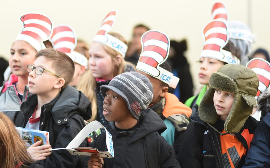 Students at Ramstein Intermediate School in Germany celebrate Dr. Seuss' birthday by wearing paper "The Cat in the Hat" hats on Thursday, March 2, 2017.