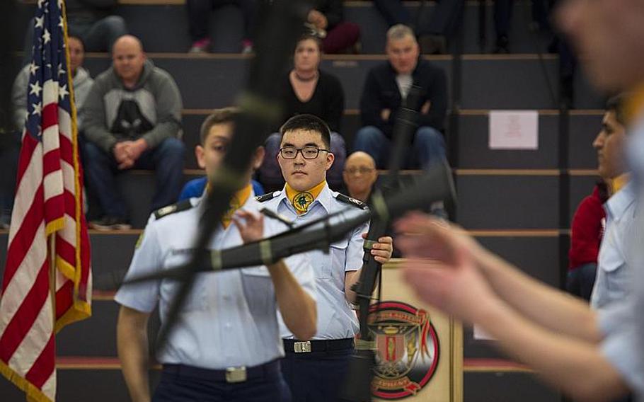 SHAPE's drill team competes in the armed team rifle exhibition during the DODEA-Europe JROTC drill team championships in Kaiserslautern, Germany, on Saturday, March 4, 2017. SHAPE won the event.