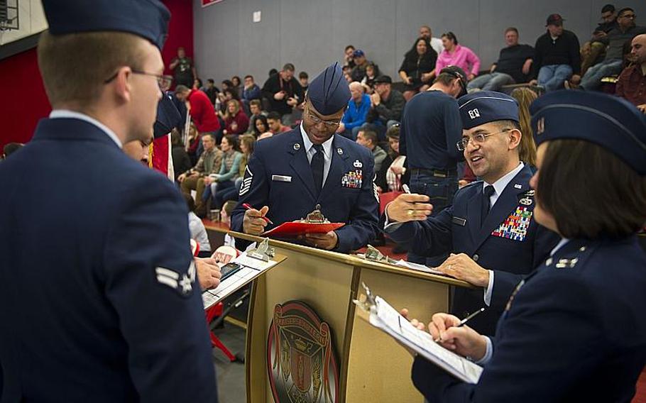Airmen compare scores after judging a drill event during the DODEA-Europe JROTC drill team championships in Kaiserslautern, Germany, on Saturday, March 4, 2017.