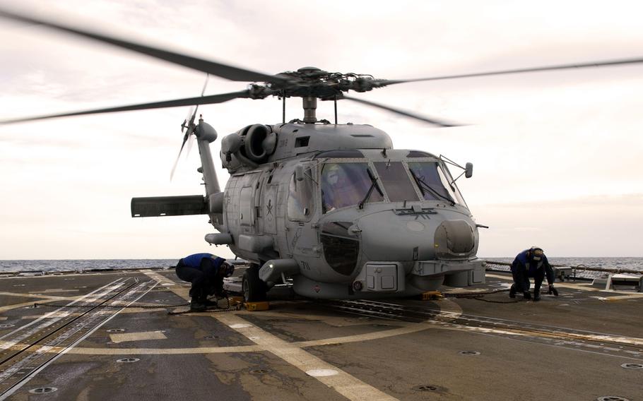 Sailors assigned to the guided-missile destroyer USS Truxtun secure an MH-60R Sea Hawk helicopter to the flight deck, Jan. 23, 2017. Truxtun's crew conducted a medical evacuation of a Pakistani navy sailor in the 5th Fleet area of operations on Monday, March 6, 2017.