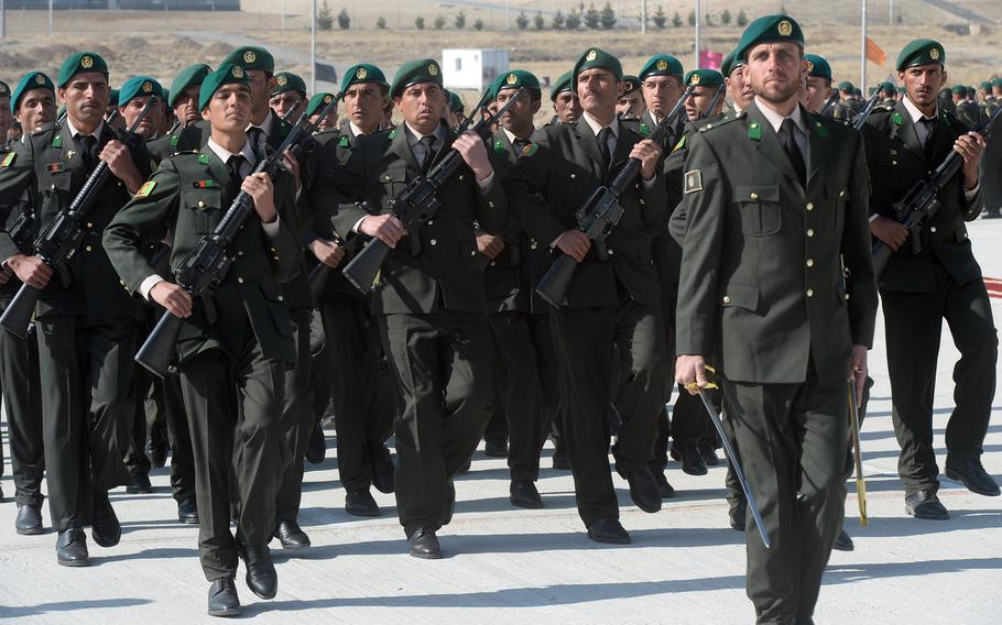 Afghan cadets march at a training area near Camp Qargah on Thursday, March 9, 2017, before graduating to become Afghan army officers.
