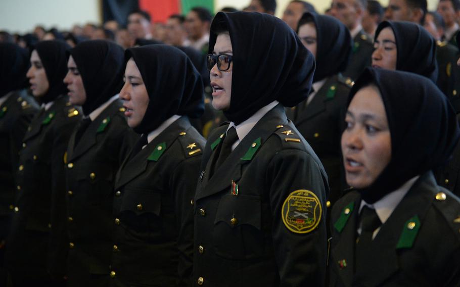 Second Lt. Hamida Haidery, second from right, attends a graduation ceremony near Camp Qargah, where she and 21 other females became officers in the Afghan army, Thursday, March 9, 2017,