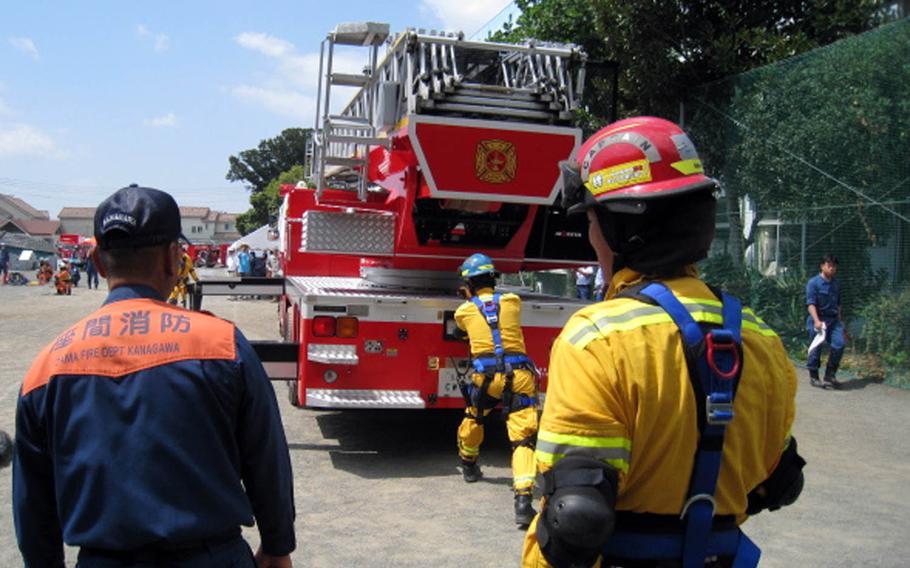 Camp Zama firefighters work with a Japanese unit from Zama City during disaster-response training in 2013.