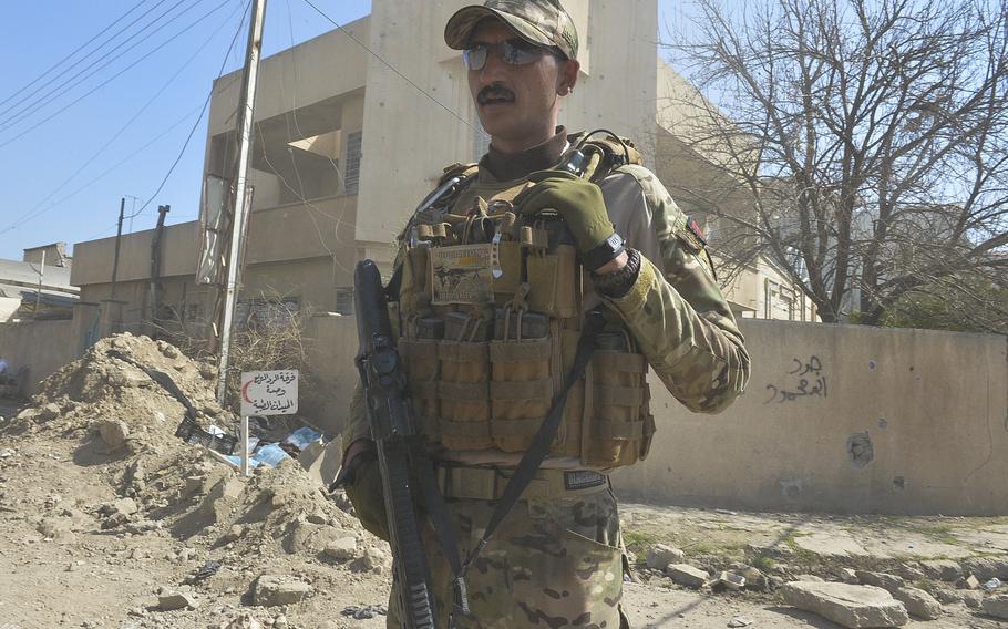 An Iraqi emergency response division soldier stands guard near a medical field clinic in western Mosul on Thursday, March 9, 2017.