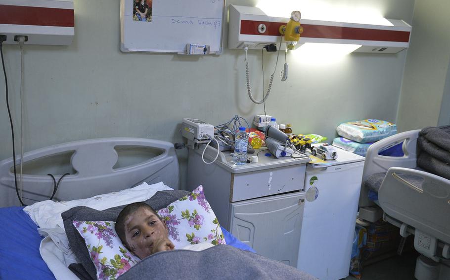 Yasiv, 11, wounded with burns from an apparent chemical attack in east Mosul in early March, recuperates in a hospital bed at an emergency hospital in Irbil on Saturday, March 11, 2017.