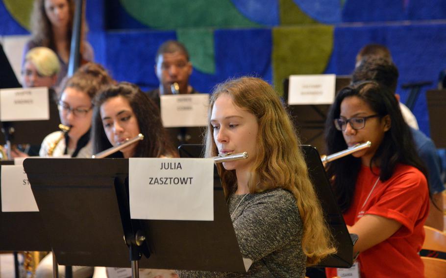 Ramstein's Julia Zasztowt plays the flute along with the rest of the honors band as they rehearse a number at the DODEA-Europe Honors Music Festival, Tuesday, March 14, 2017.
