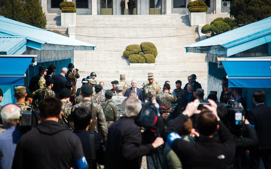 Secretary of State Rex Tillerson stands with U.S. and South Korean military officials on the demarcation line between North and South Korea at the Joint Security Area of the Demilitarized Zone, Friday, March 17, 2017.