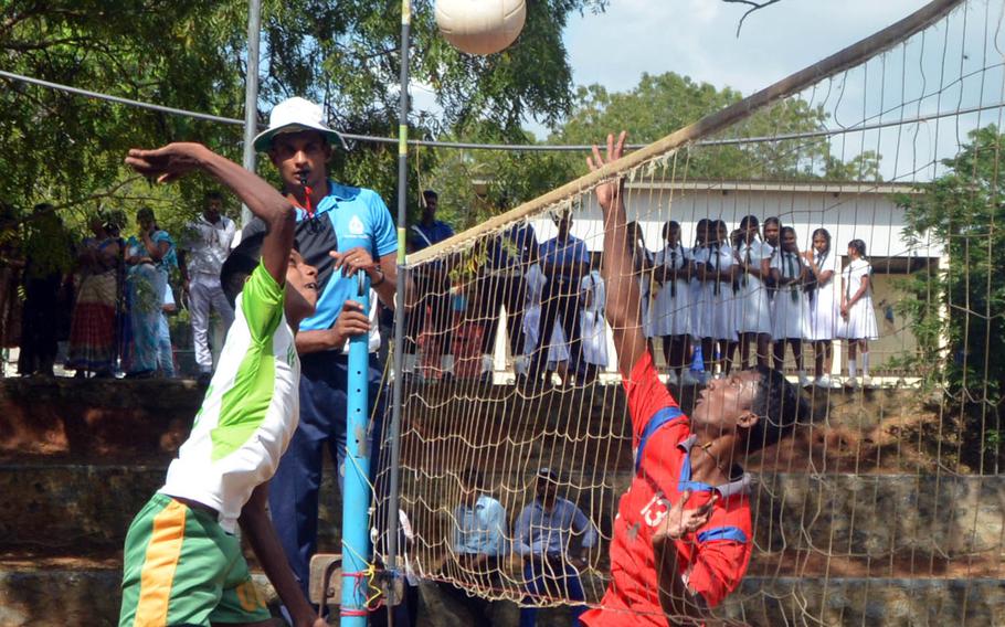 Skilled Sri Lankan teens play volleyball alongside U.S. servicemembers at a school in the village of Nonagama, on Sri Lanka's south coast. The game was part of Pacific Partnership 2017, a humanitarian and disaster-relief planning exercise.