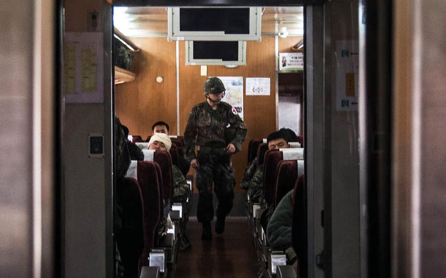 A South Korean medic evaluates casualties aboard a South Korean medical train as it travels from Seoul to Suwon, South Korea, Wednesday, March 15, 2017.