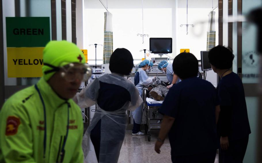 South Korean medical staff attend to a simulated casualty at Ajou University Hospital, Suwon, South Korea, Wednesday, March 15, 2017.