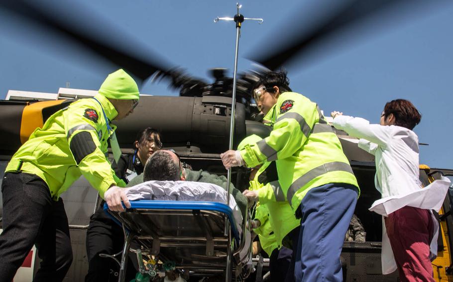 A UH-60 Blackhawk helicopter delivers a simulated casualty to Ajou University Hospital, Suwon, South Korea, Wednesday, March 15, 2017.