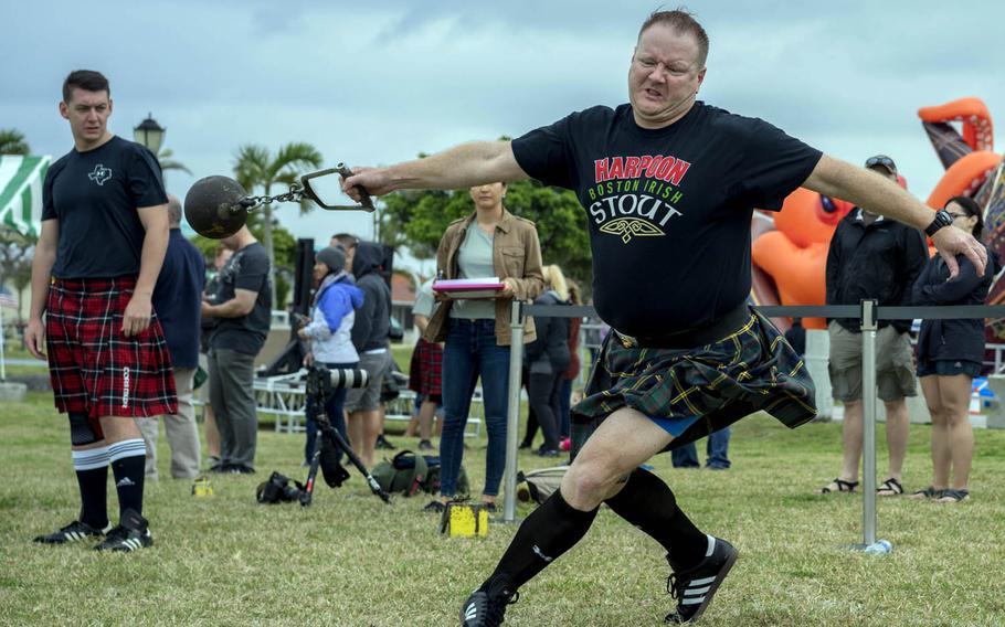 A competitor builds up momentum for the weight throw contest at the Torii Station Highland Games in Okinawa, Japan, Saturday, March 18, 2017.
