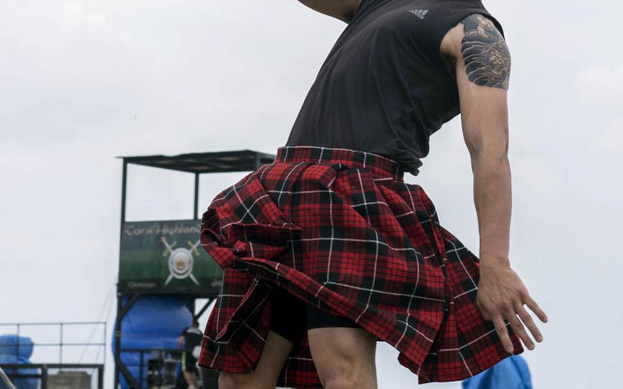 A competitor takes part in the weight for height event during the Torii Station Highland Games in Okinawa, Japan, Saturday, March 18, 2017.