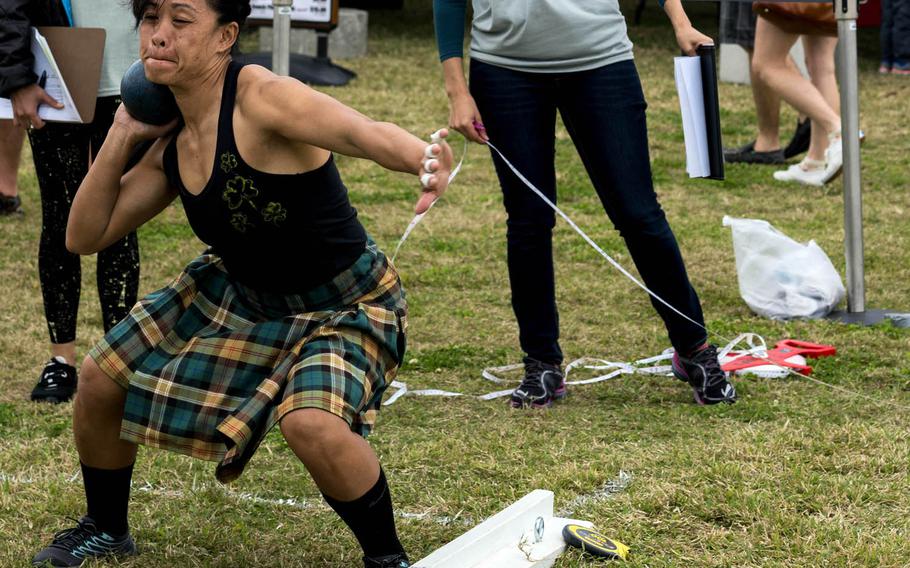 A competitor prepares for the stone put event during the Torii Station Highland Games in Okinawa, Japan, Saturday, March 18, 2017.