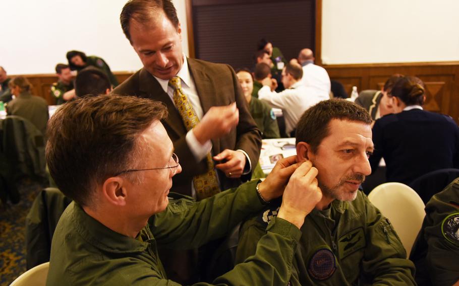 Thomas Piazza, the director of the Air Force's acupuncture program at Joint Base Andrews in Maryland, instructs during the battlefield acupuncture workshop on Tuesday, March 21, 2017, at Ramstein Air Base, Germany.