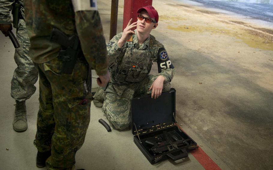 Staff Sgt. Shane Fairchild prepares an MP5K operational briefcase for a German soldier in Kaiserslautern, Germany, on Thursday, March 23, 2017.
