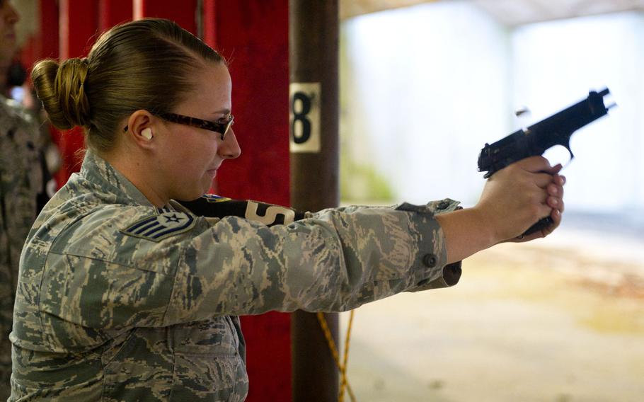 Staff Sgt. Briana Stanley fires an M9 in Kaiserslautern, Germany, on Thursday, March 23, 2017.